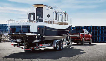 2022 Nissan TITAN Truck towing boat | Destination Nissan in Albany NY