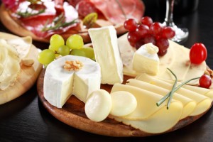 Cheese and salami platter with herbs